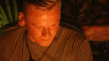 a man wearing a headset looks down at something