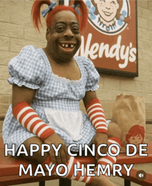 a wendy 's sign is behind a woman dressed in a wendy 's costume