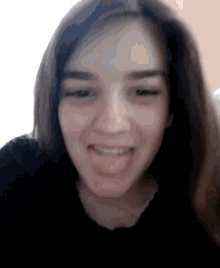 a close up of a woman making a funny face