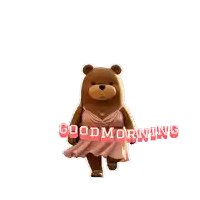 a teddy bear wearing a pink dress and a gold necklace says good morning