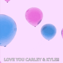 a pink and blue balloon with the words " love you carley & kyle "