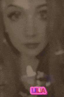 a woman 's face is surrounded by colorful butterflies and the name lilianna