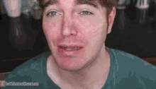 a close up of a man 's face with lolshanedawson written on the bottom right corner