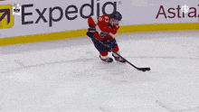 a hockey player with the number 2 on his jersey stands on the ice