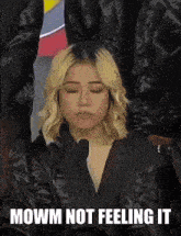 a woman with her eyes closed and the words " mowm not feeling it " below her