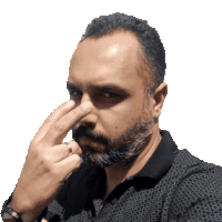 a man with a beard is touching his nose