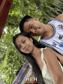 a man and a woman are posing for a picture with a caption that says нен