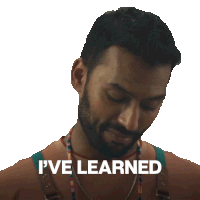 a man with a beard says " i 've learned " in front of his face