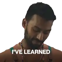 a man with a beard says " i 've learned " in front of his face