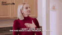 a woman in a red sweater says i don t know why she has such a big problem with you