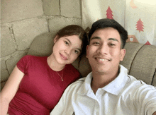a man and a woman are posing for a picture