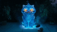 a blue cat with a star on its head is sitting on the ground