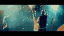a group of people holding flares in the air with the words we will meet again on the bottom of the screen