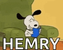 snoopy is sitting in a chair reading a book and holding a cup .