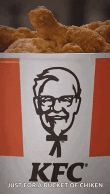 a bucket of kfc chicken with a man 's face on it .