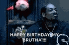 snoop dogg is smoking a cigarette and saying `` happy birthday my brutha !!! ''