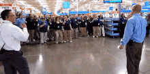 a group of people are dancing in a store with a sign that says " low price "