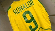 a yellow and green ronaldo jersey with the number 9 on it