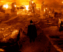 a man in a black jacket is walking through a burning area