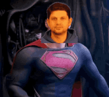 a man in a superman costume stands in front of a dark background