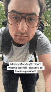 a man with glasses and a backpack says misery monday i don 't wanna work