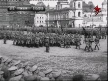 a black and white photo of soldiers marching in a parade with the date march 19 1915