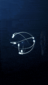 a blue sphere with a light inside of it on a dark blue background .