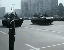 a black and white photo of a military parade with a sign that says ' a.m. ' on it
