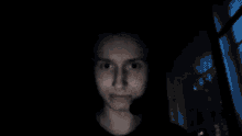 a blurry picture of a person 's face with a blue background