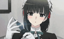 a girl in a maid outfit is holding a glass