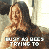 a woman holding a child with the words busy as bees trying to on the bottom
