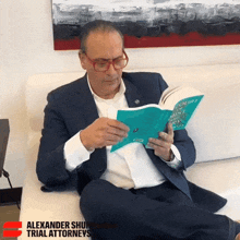 a man in a suit sits on a couch reading a book titled court