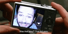 a person is taking a picture of a man with the words was that sexy