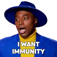 a man wearing a blue hat and a yellow turtleneck says " i want immunity "