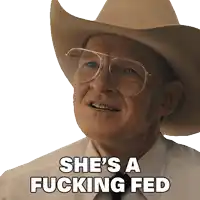 a man with glasses and a cowboy hat says she 's a fucking fed