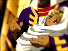 a man is holding a baby wrapped in a white blanket with a purple shirt on
