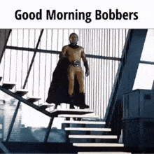 a man in a superhero costume is walking down stairs .