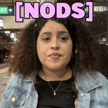 a woman in a denim jacket has the word [ nods ] above her head