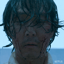 a close up of a man 's face with a netflix logo visible