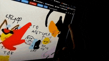 a person is holding a tablet with a drawing on it and the word tok is on the screen