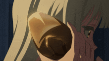 a woman holding a brown object in her hand