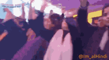 a blurry picture of a crowd of people with the hashtag @im_alhindi at the bottom