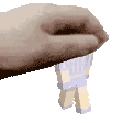 a close up of a person 's hand holding a small toy .