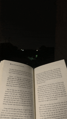 a book is open to a page with a foreign language on it