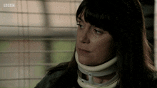 a woman wearing a neck brace is on bbc television