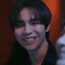 a close up of a person 's face with a smile on it