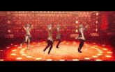 four anime characters are dancing on a stage