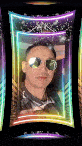 a man wearing sunglasses is surrounded by colorful neon lights