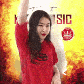 a woman in a red shirt is dancing in front of a korat logo