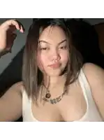 a woman with a necklace that says 2005 on her chest